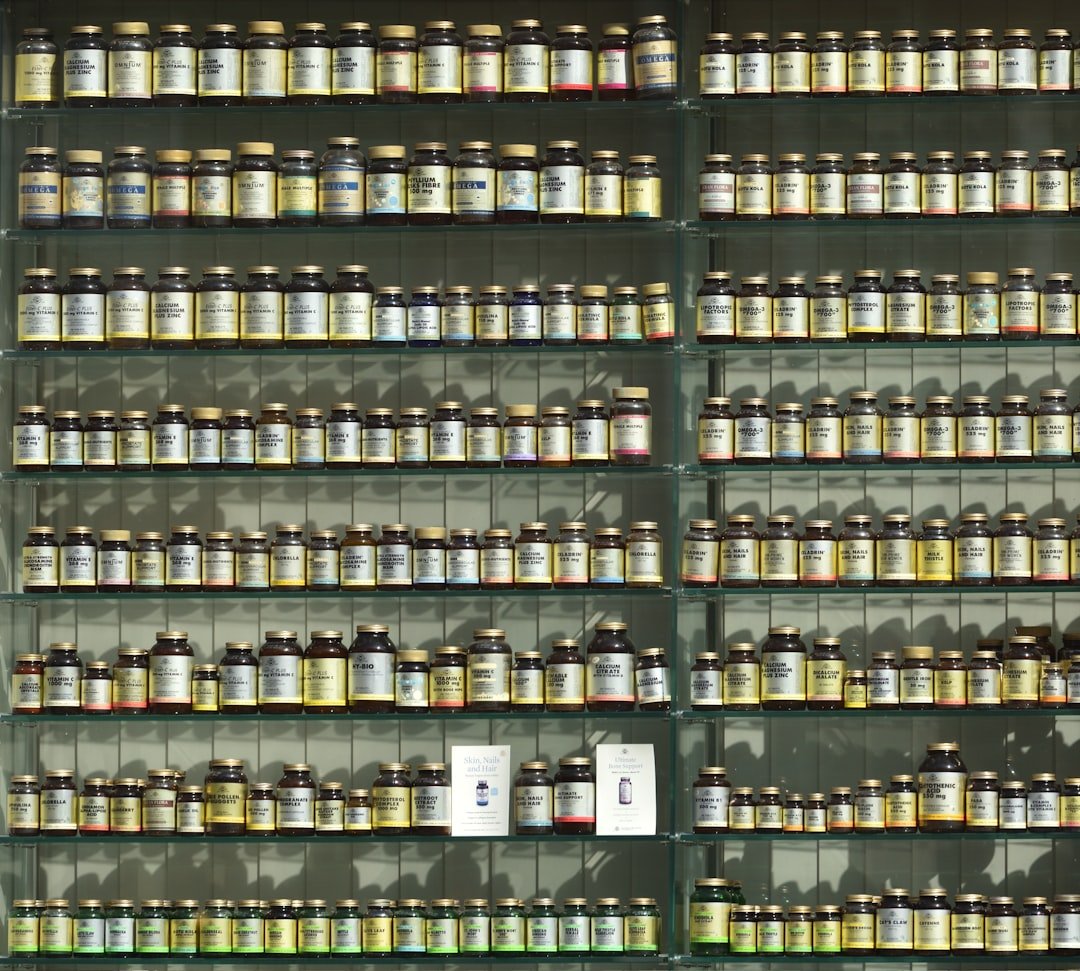 A neatly organized shelf or cabinet displaying various vitamins and supplements in labeled containers, showcasing a clean and safe home environment.